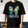 Alt Text: Pretty Charlie Brown fist bump with Snoopy on Seattle sports T-shirt featuring Mariners and Seahawks logos.