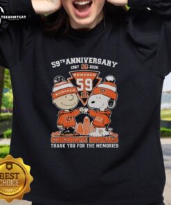 Alt Text: Stylish Cincinnati Bengals outfit featuring Snoopy and Charlie Brown sweatshirt for the 59th anniversary, 1967-2026.