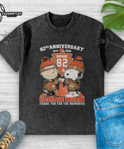 Pretty Cleveland Browns outfit featuring Snoopy and Charlie Brown 82nd Anniversary washed t-shirt, perfect for fans.