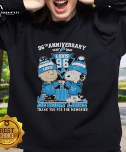 Alt Text: Stylish Detroit Lions outfit featuring a Snoopy and Charlie Brown sweatshirt, celebrating the 96th anniversary (1930-2026).