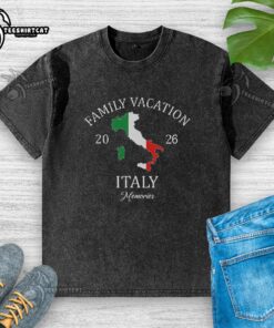 Family enjoying a vacation in Italy 2026, wearing matching washed t-shirts, smiling together in a scenic location.