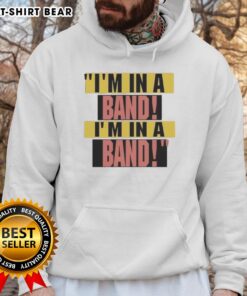 Alt Text: Hayley Williams wearing I'm In A Band hoodie, showcasing her stylish look and vibrant personality.