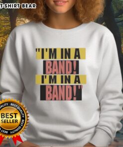 Hayley Williams wearing 'I'm In A Band' sweatshirt, showcasing her unique style and vibrant personality.