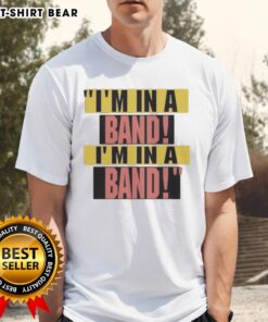 Alt Text: Pretty Hayley Williams wearing an I'M In A Band t-shirt, showcasing her stylish look and vibrant personality.