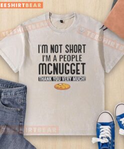 Alt Text: Funny washed t-shirt with 'Pretty I'm Not Short, I'm a People McNugget, Thank You Very Much' graphic design.