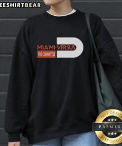 Alt Text: Miami Hurricanes football sweatshirt featuring 'Miami Versus The Committee' logo, perfect for fans and game day.