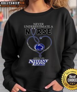 Nurse wearing a Penn State Nittany Lions sweatshirt, showcasing love for football and dedication to healthcare.