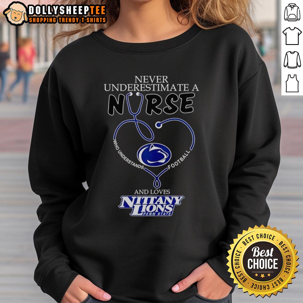 Pretty Never Underestimate A Nurse Who Understands Football And Loves Penn State Nittany Lions Heart Sweatshirt Nurse wearing a Penn State Nittany Lions sweatshirt, showcasing love for football and dedication to healthcare.