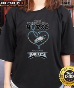 Pretty nurse in Philadelphia Eagles tee, showcasing love for football and healthcare, inspiring confidence and pride.