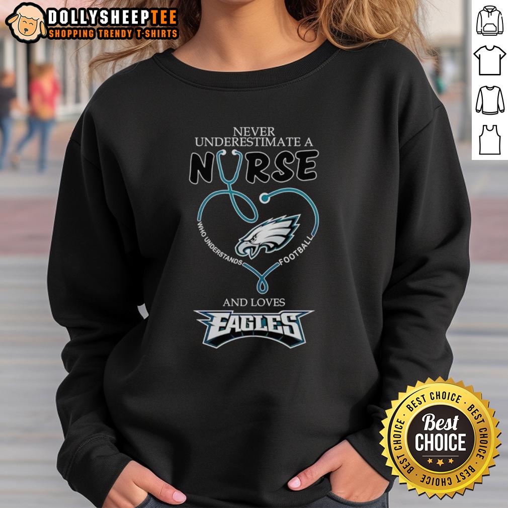 Pretty Never Underestimate A Nurse Who Understands Football And Loves Philadelphia Eagles Heart Sweatshirt Alt Text: Pretty sweatshirt saying 'Never underestimate a nurse who loves football' with Philadelphia Eagles theme.