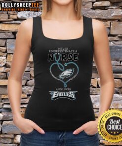 Pretty nurse in a heart tank top showing love for Philadelphia Eagles and football, emphasizing passion and dedication.