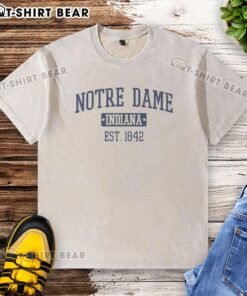 Alt Text: Vintage washed t-shirt featuring Pretty Notre Dame Indiana Est 1842 graphic, perfect for fans and casual wear.