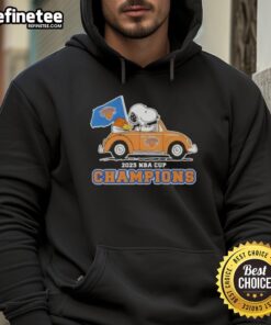Alt Text: Snoopy driving a car in a New York Knicks hoodie celebrating the 2025 NBA Cup Champions with pretty peanuts design.