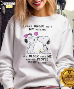 Pretty Peanuts Snoopy sweatshirt featuring 'I can't argue with my husband, he's older than me' design in vibrant colors.