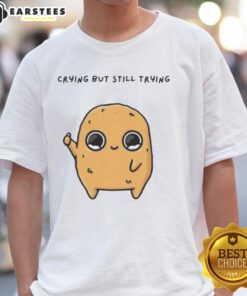 Alt Text: Cute cartoon mascot T-shirt featuring a sad Nuggie crying but trying to be cheerful, perfect for quirky fashion.