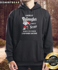 Cozy Christmas hoodie featuring Snoopy with 'I work at Bojangles, I don't stop when I'm tired' text for holiday cheer.