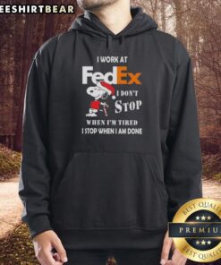 Alt Text: Pretty Snoopy Christmas hoodie with 'I work at FedEx, I don't stop when I'm tired, I stop when I'm done' text.