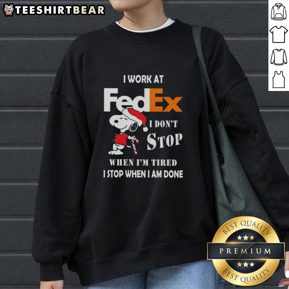 pretty-snoopy-i-work-at-fedex-i-dont-stop-when-im-tired-i-stop-when-i-am-done-christmas-sweatshirt Cozy Christmas sweatshirt featuring Snoopy with the quote 'I don't stop when I'm tired, I stop when I'm done' for FedEx workers.