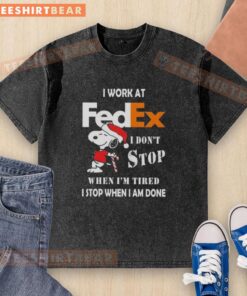 Alt Text: Cute Snoopy graphic on a Christmas-themed washed t-shirt for FedEx, featuring the quote about hard work and dedication.