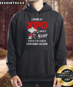 Alt Text: Pretty Snoopy Christmas hoodie with 'I work at Xpo, I don't stop when I'm tired, I stop when I'm done' slogan.