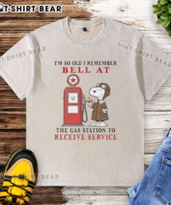 Alt Text: Vintage Snoopy t-shirt featuring the phrase about remembering gas station service bells, perfect for nostalgic fans.