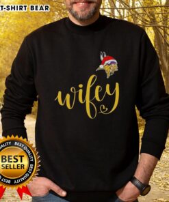 Alt Text: Pretty Wifey Minnesota Vikings Santa Hat Merry Christmas Sweatshirt featuring festive design and team colors for holiday spirit.