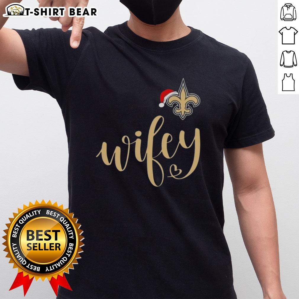 Pretty Wifey New Orleans Saints Santa Hat Merry Christmas T Shirt Pretty Wifey New Orleans Saints Santa Hat Merry Christmas T-Shirt featuring festive design and team colors for holiday cheer.