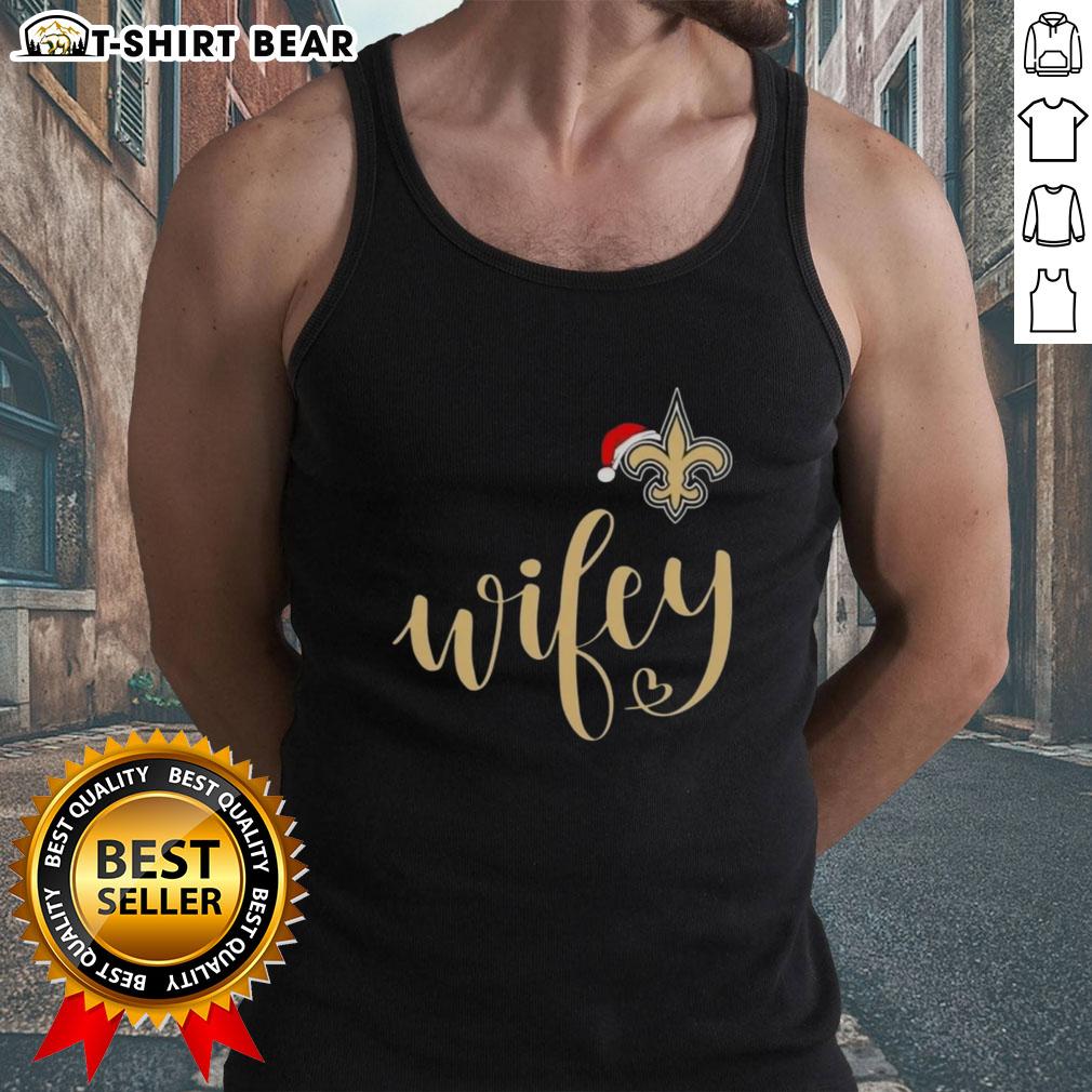 Pretty Wifey New Orleans Saints Santa Hat Merry Christmas Tank Top Pretty Wifey New Orleans Saints Santa Hat Merry Christmas Tank Top worn by a woman, showcasing festive holiday spirit.