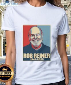 Alt Text: Good Rest In Peace Rob Reiner 1947-2025 Retro Ladies Tee featuring a vintage design and tribute to the iconic filmmaker.