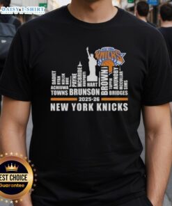Alt Text: Top 2025-26 New York Knicks Basketball T-Shirt featuring city skyline design and player names, perfect for fans.