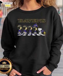 Top Baltimore Ravens x Peanuts Snoopy and Friends Abbey Road sweatshirt featuring vibrant character graphics and team colors.