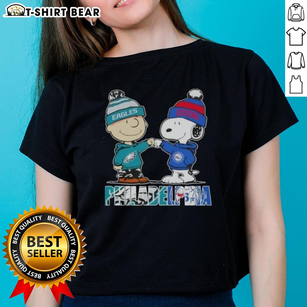 Top Charlie Brown And Snoopy Philadelphia City Sports Eagles X 76Ers Ladies Tee Top Charlie Brown and Snoopy Philadelphia City Sports Eagles X 76ers ladies tee featuring iconic characters and team logos.