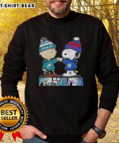 Top Charlie Brown and Snoopy Philadelphia City Sports Eagles X 76ers sweatshirt featuring iconic characters in vibrant colors.