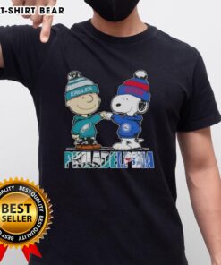 Alt Text: Top Charlie Brown and Snoopy Philadelphia City Sports Eagles x 76ers T-Shirt featuring iconic cartoon characters.
