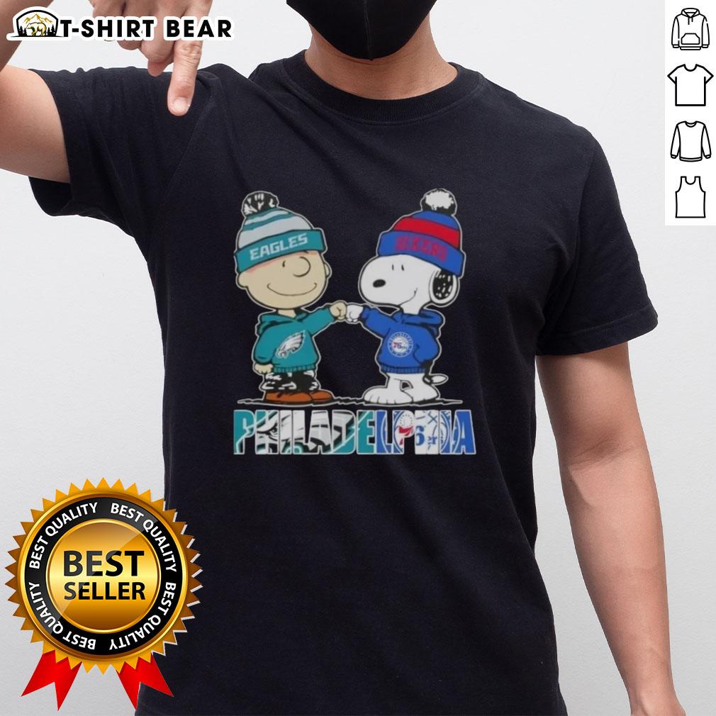 Top Charlie Brown And Snoopy Philadelphia City Sports Eagles X 76Ers T Shirt Alt Text: Top Charlie Brown and Snoopy Philadelphia City Sports Eagles x 76ers T-Shirt featuring iconic cartoon characters.