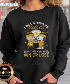 Alt Text: Top Charlie Brown and Snoopy Pittsburgh Steelers sweatshirt with 'I Will Always Be Beside You' slogan.