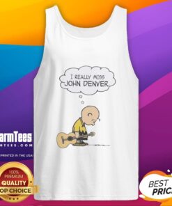 Charlie Brown wearing a tank top holding a guitar, expressing nostalgia for John Denver's music.
