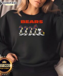 Top Chicago Bears X Peanuts Snoopy and Friends Abbey Road Sweatshirt featuring iconic characters in a fun design.