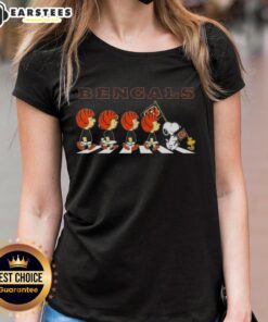 Alt Text: Top Cincinnati Bengals X Peanuts Snoopy and Friends Abbey Road ladies tee featuring playful character designs.