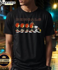 Alt Text: Top Cincinnati Bengals X Peanuts Snoopy And Friends Abbey Road T-Shirt featuring Snoopy and friends in Bengals gear.
