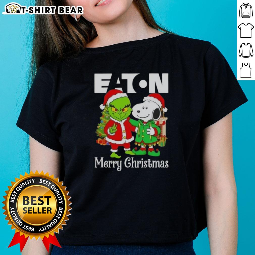 Top Eaton Corporation X Grinch And Snoopy Merry Christmas Ladies Tee Alt Text: Ladies' tee featuring Eaton Corporation X Grinch and Snoopy designs for a merry Christmas celebration.