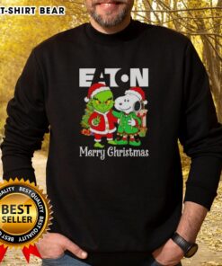 Top Eaton Corporation X Grinch and Snoopy Merry Christmas sweatshirt featuring colorful holiday designs and festive graphics.
