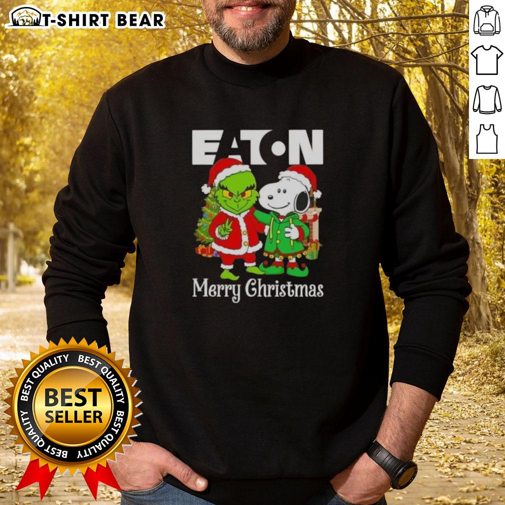 Top Eaton Corporation X Grinch And Snoopy Merry Christmas Sweatshirt Top Eaton Corporation X Grinch and Snoopy Merry Christmas sweatshirt featuring colorful holiday designs and festive graphics.