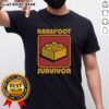 Top Foot Brick Survivor T-Shirt featuring a playful design for barefoot Lego enthusiasts and fans of fun apparel.