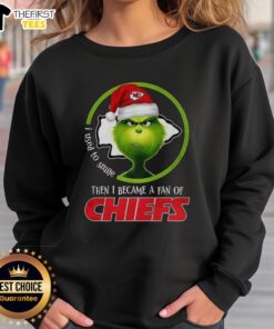 Alt Text: Top Grinch I Used To Smile Then I Became A Fan Of Chiefs Sweatshirt featuring a fun holiday design for fans.