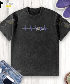 Alt Text: Baltimore Ravens football logo graphic on a washed t-shirt, perfect for fans of the NFL team.