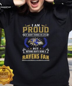 Alt Text: Cozy sweatshirt featuring 'I Am Proud Of Many Things But Nothing Beats Being A Baltimore Ravens Fan' design.