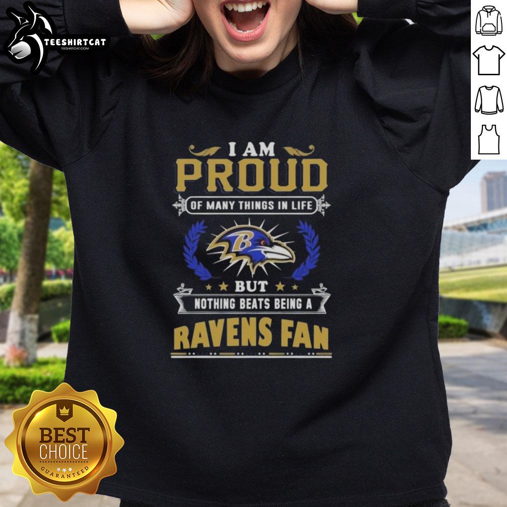 top-i-am-proud-of-many-things-in-life-but-nothing-beats-being-a-baltimore-ravens-fan-sweatshirt Alt Text: Cozy sweatshirt featuring 'I Am Proud Of Many Things But Nothing Beats Being A Baltimore Ravens Fan' design.