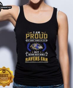 Top featuring 'I Am Proud Of Many Things But Nothing Beats Being A Baltimore Ravens Fan' design in bold lettering.
