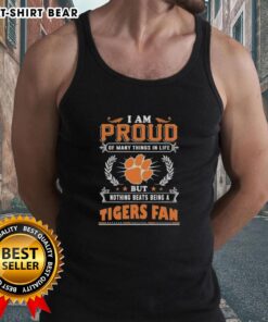Woman wearing a Clemson Tigers fan tank top, proudly showcasing her love for the team and school spirit.